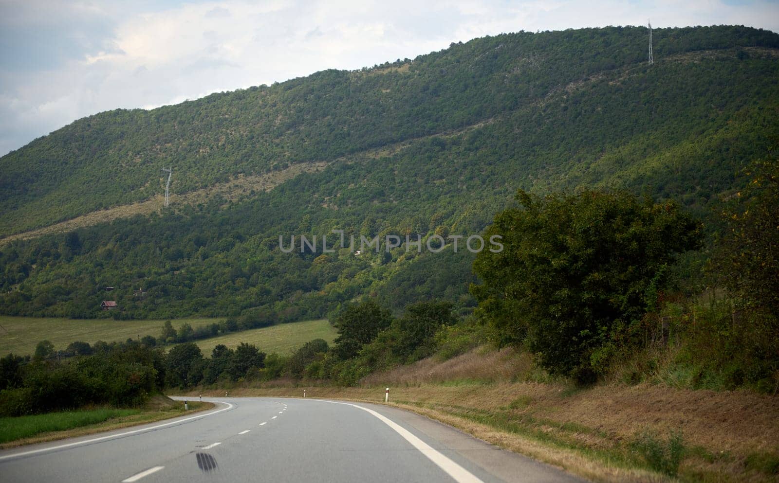 Driver's point of view to a road in Carpathian mountain ridge. Travel concept- Landscape scenery and nature background