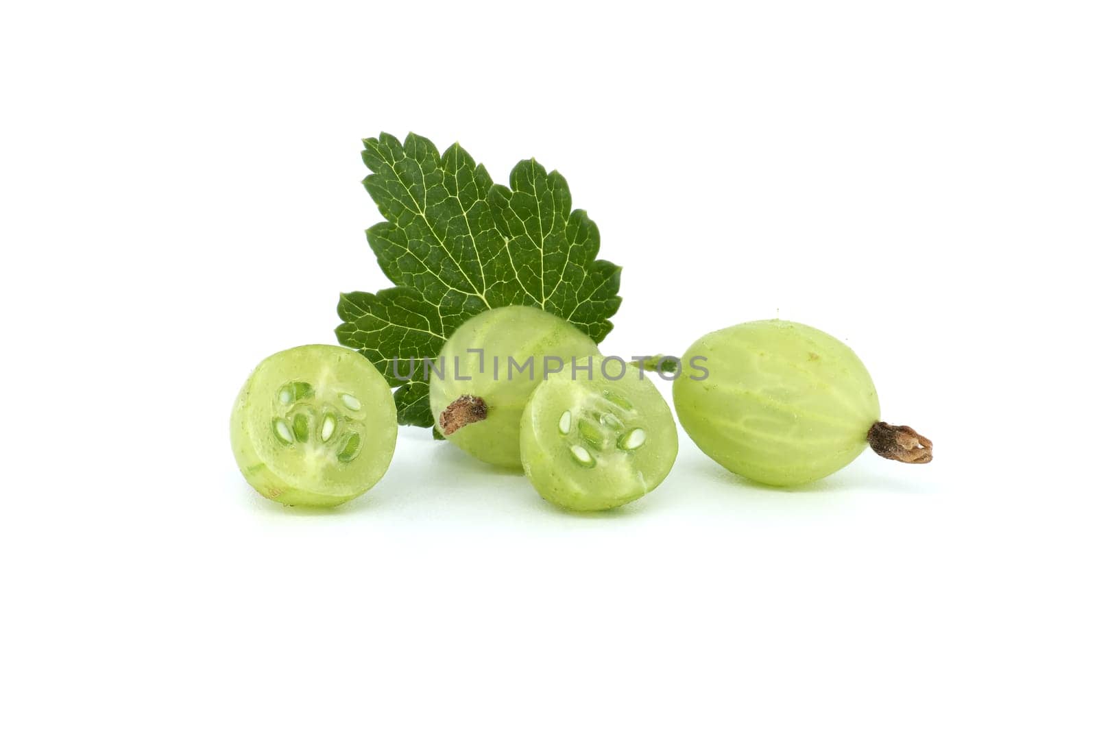 Fresh green gooseberries with a green leaf on a white background. Includes whole and sliced berries, showcasing seeds and texture.