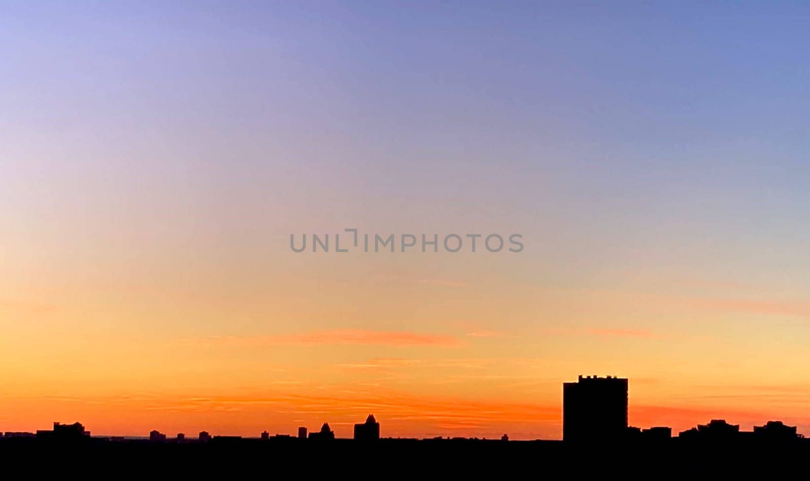 Evening city sky, sunset over city, beautiful landscape. High quality photo