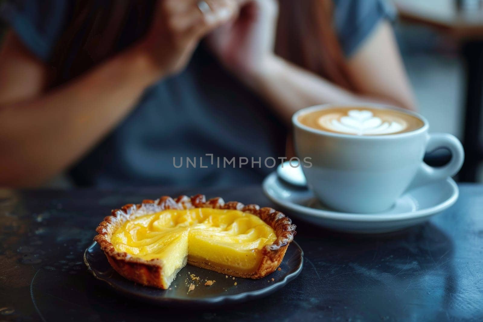 Hong Kong Egg Tart with woman drink hot coffee in cafe..