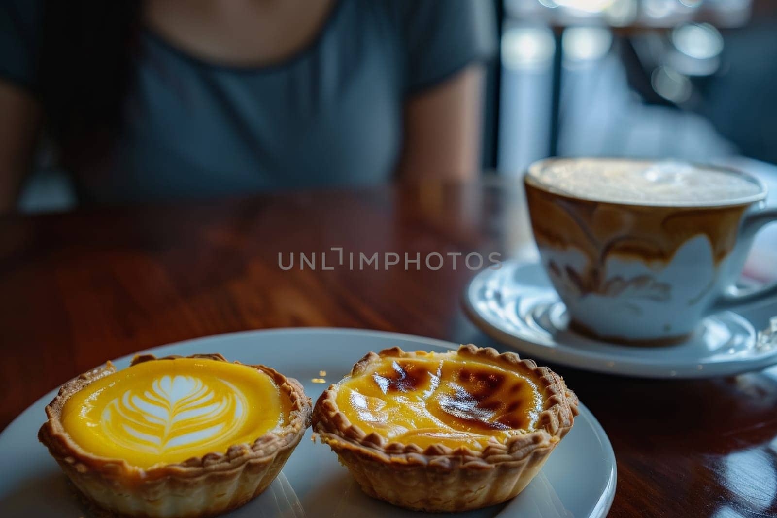 Hong Kong Egg Tart with woman drink hot coffee in cafe..