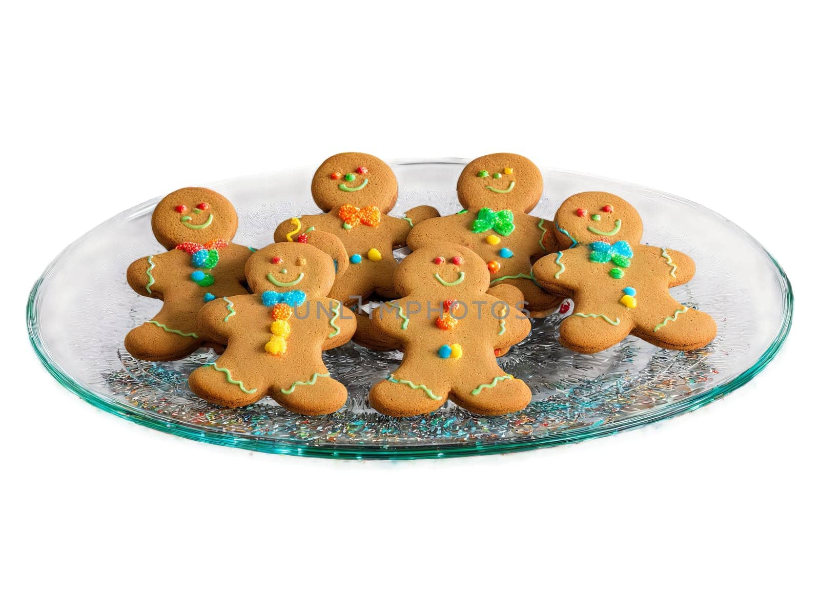 Cookies gingerbread men with colorful icing arranged on a transparent glass plate festive and fun. Food isolated on transparent background.