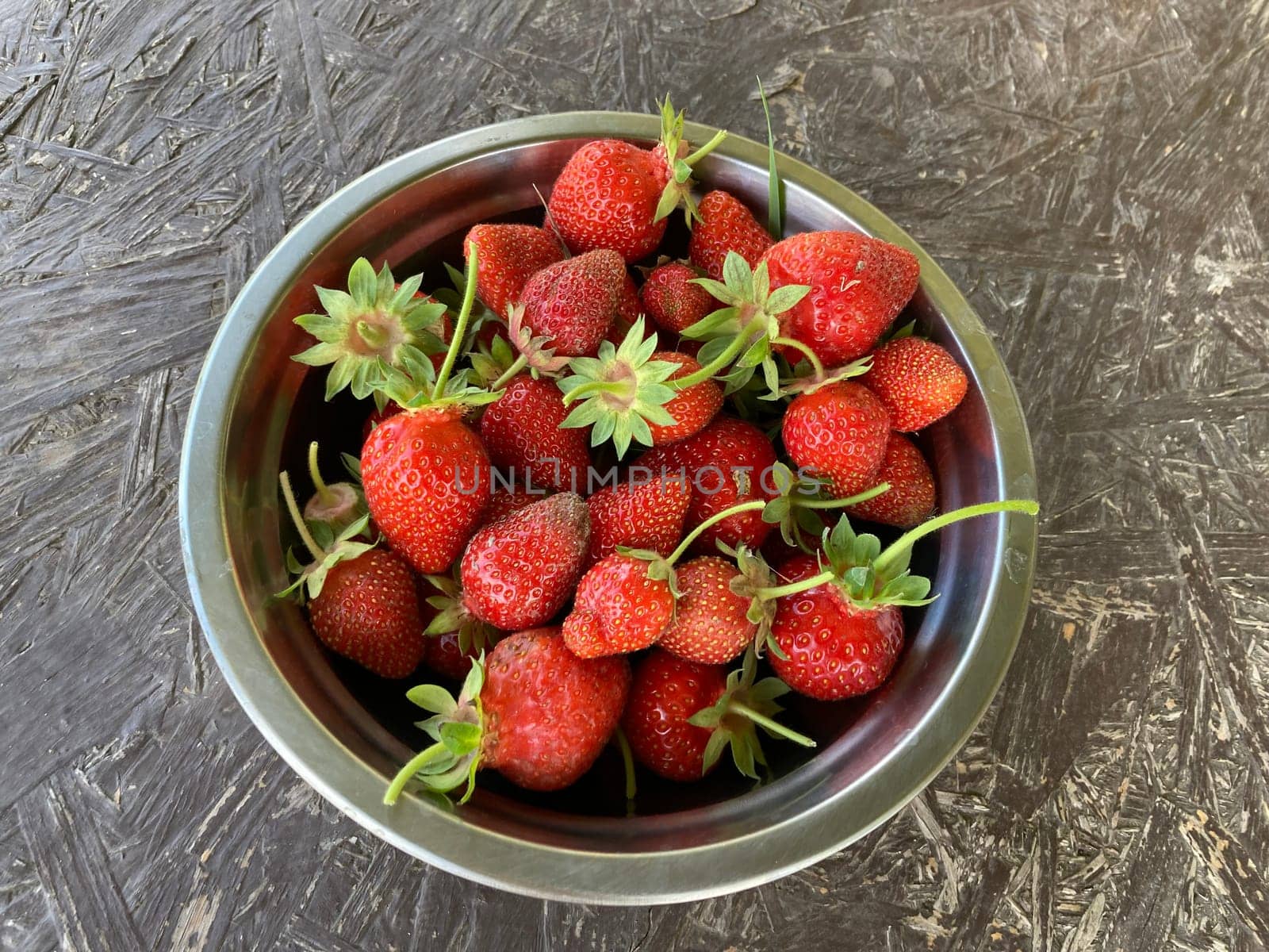 Young large strawberries grew in a the village