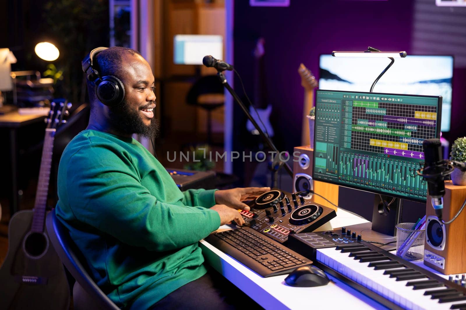 Young musician twisting knobs and mixing tunes with a console by DCStudio