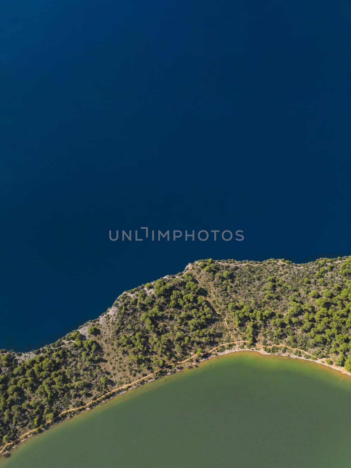 Drone view of land with forest between sea and lake, Telascica National Park, Croatia by Popov