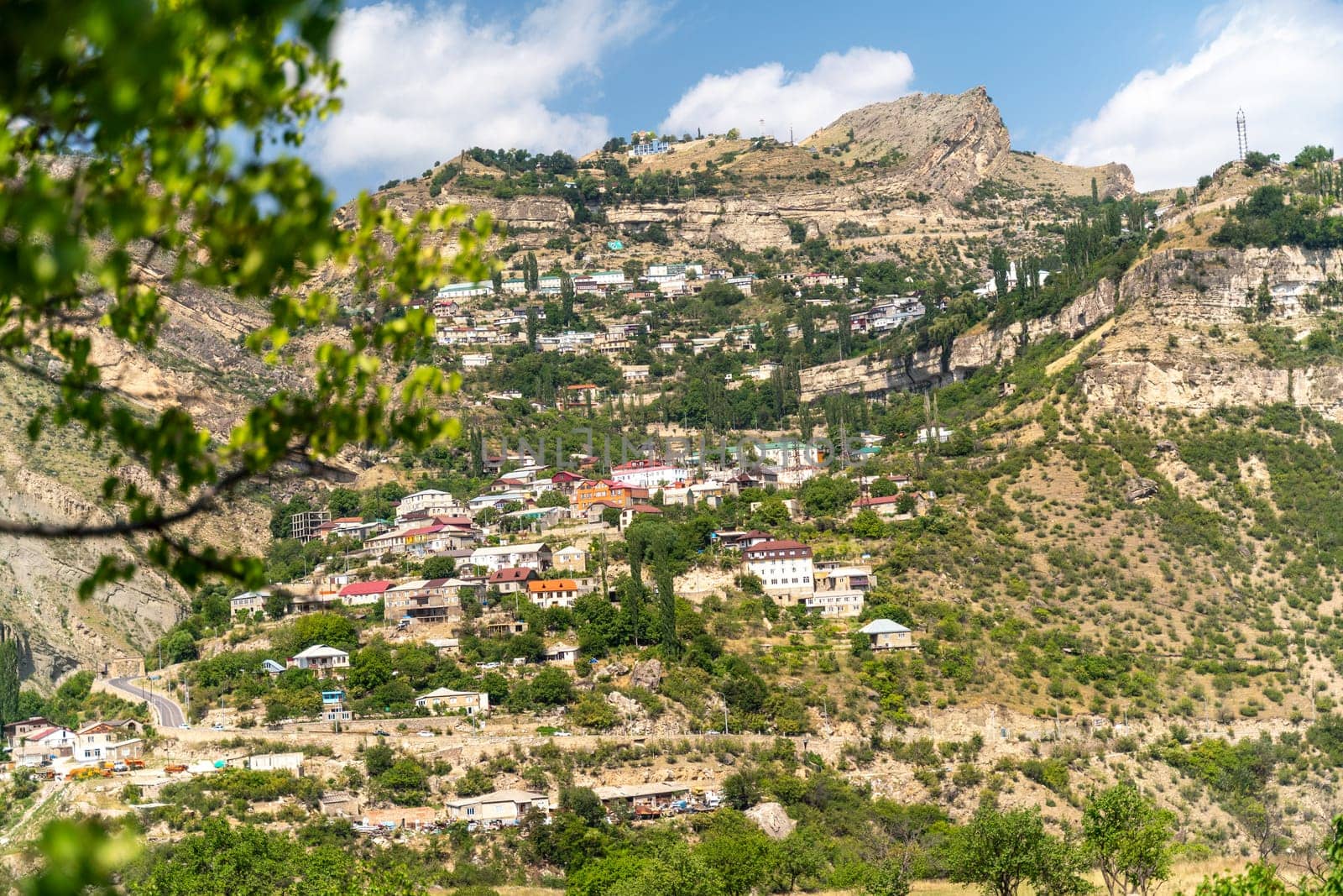 Village of Goor in Dagestan. Facades of houses located in tiers on a steep slope, summer landscape