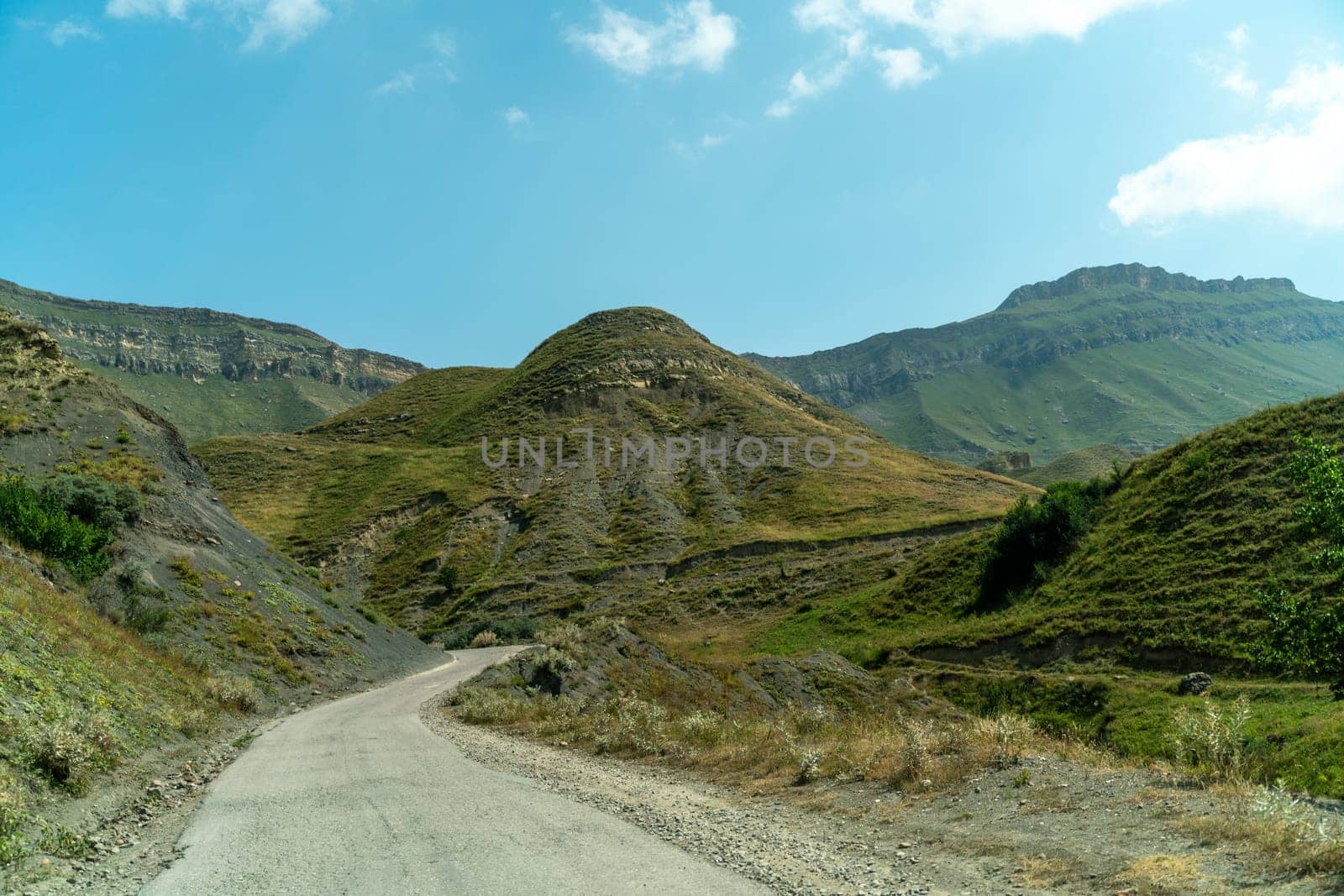 View from the car of an asphalt road in the mountainous area of Dagestan.