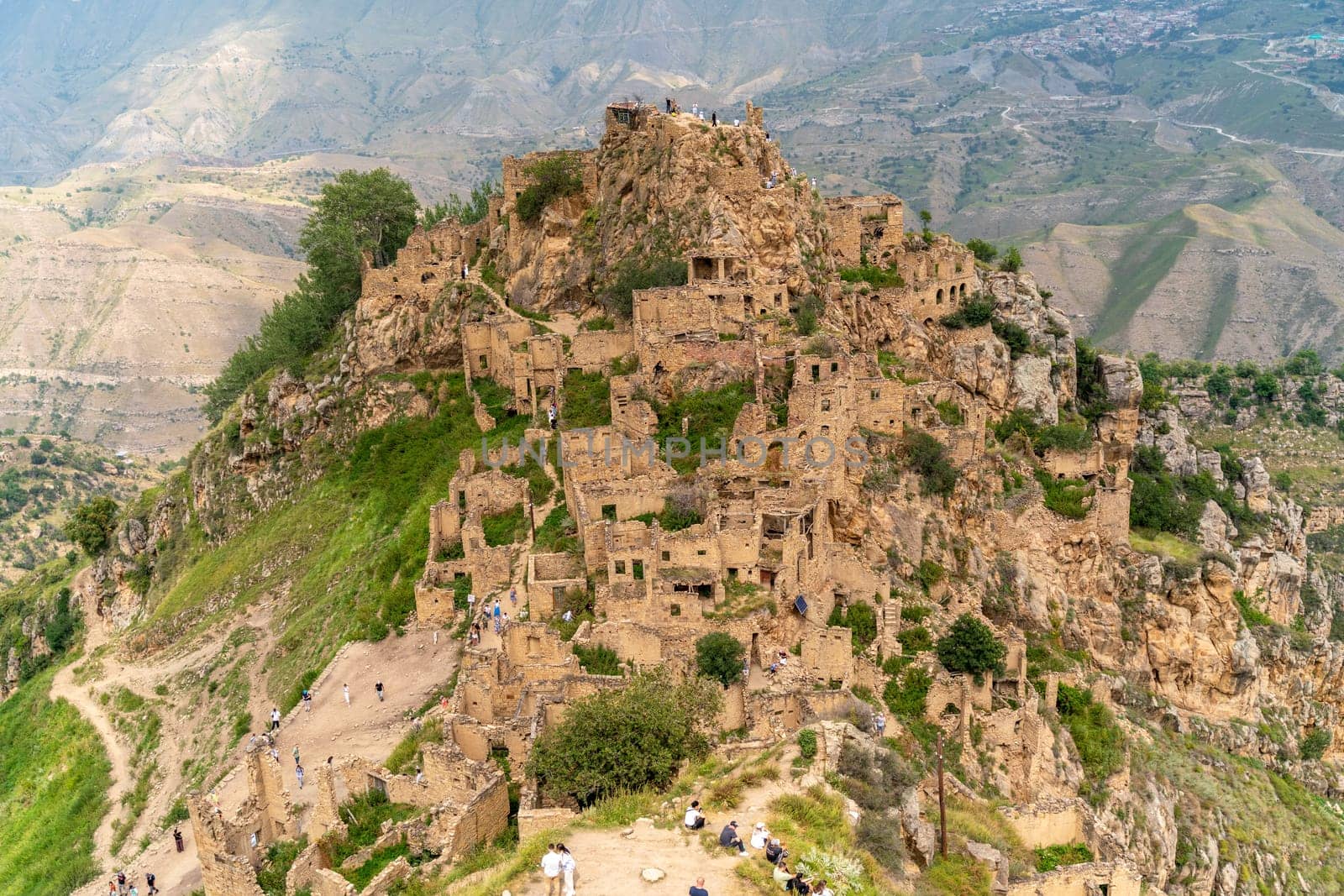 Dagestan Gamsutl. Ancient ghost town of Gamsutl old stone houses in abandoned Gamsutl mountain village in Dagestan, Abandoned etnic aul, summer landscape