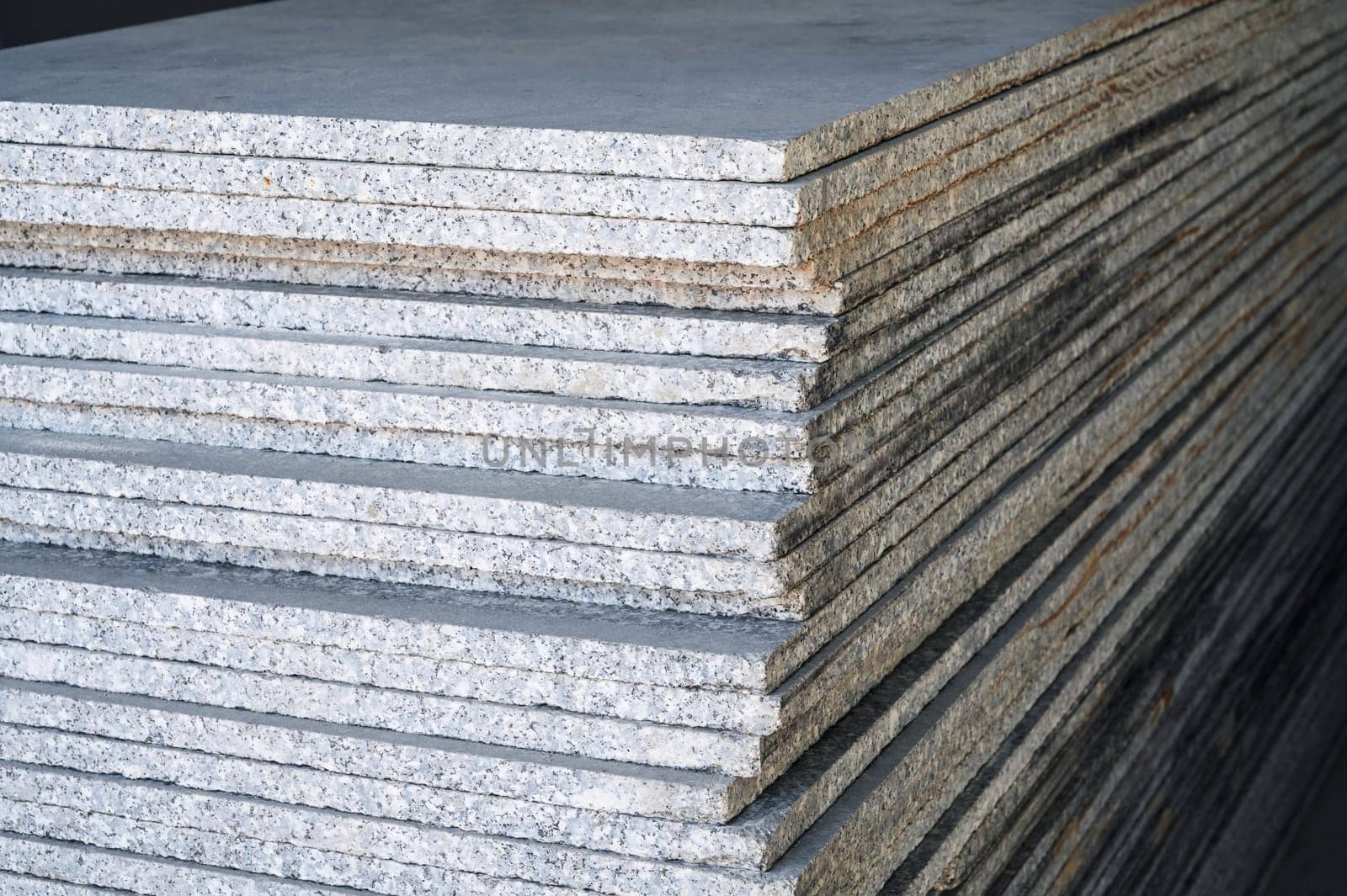 stack of white marble slabs on the construction site for the decoration of the facade of the building