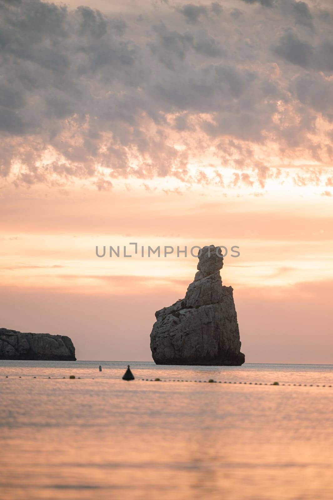 Sunset on Benirras beach in Ibiza in summer.