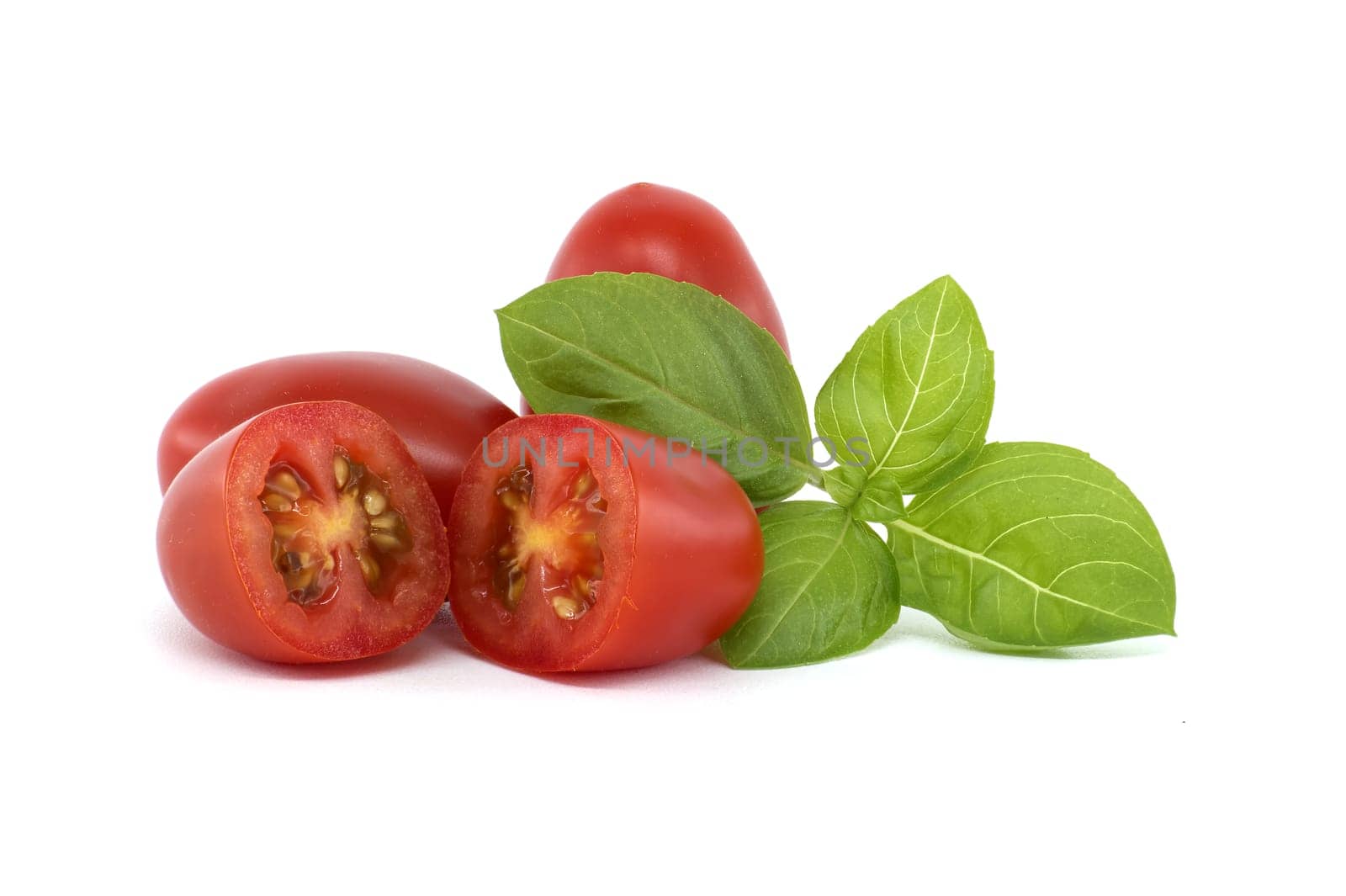 Close-up of fresh Roma tomatoes, including halved ones, alongside basil leaves on a white background. Perfect for illustrating healthy eating and fresh ingredients.