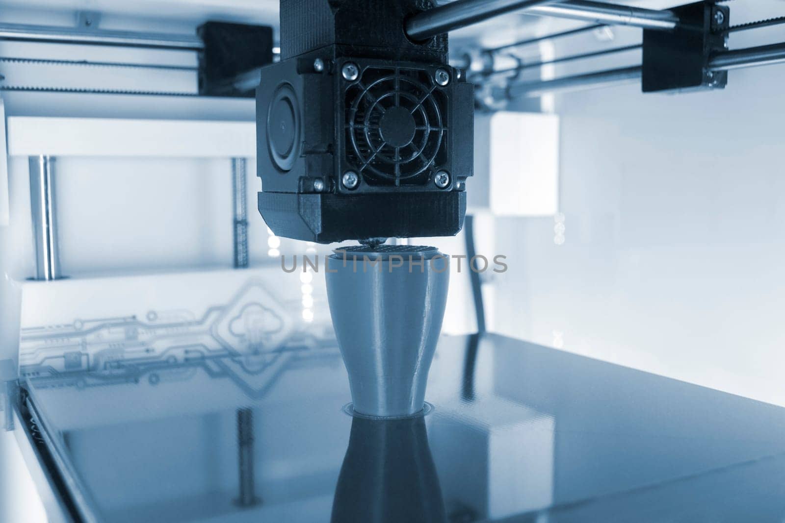 3D printer printing model. Equipment of 3D printer during process of printing by Mari1408