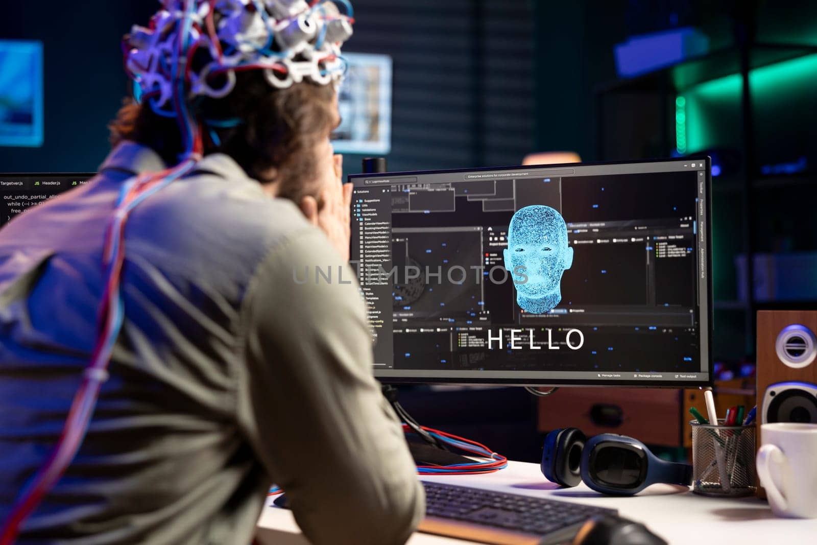 IT professional using EEG headset to communicate with artificial intelligence by DCStudio