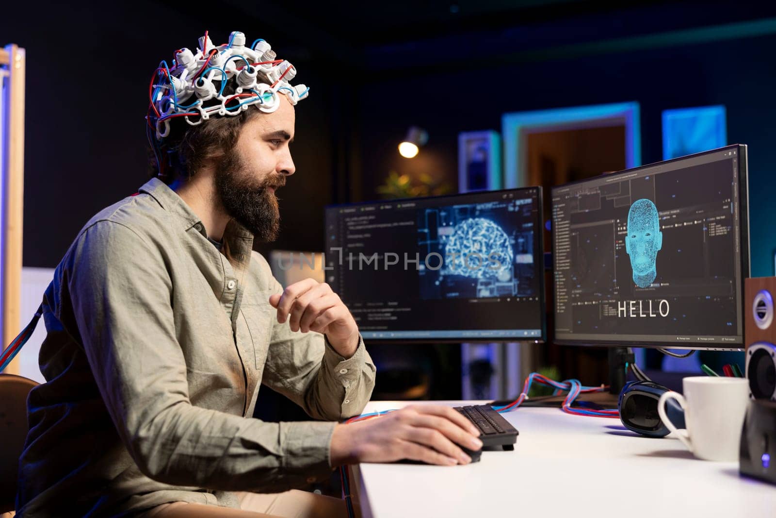 Man using EEG headset to communicate with artificial intelligence on computer in binary code. Programmer sending brainwave signals to AI entity on PC using high tech device