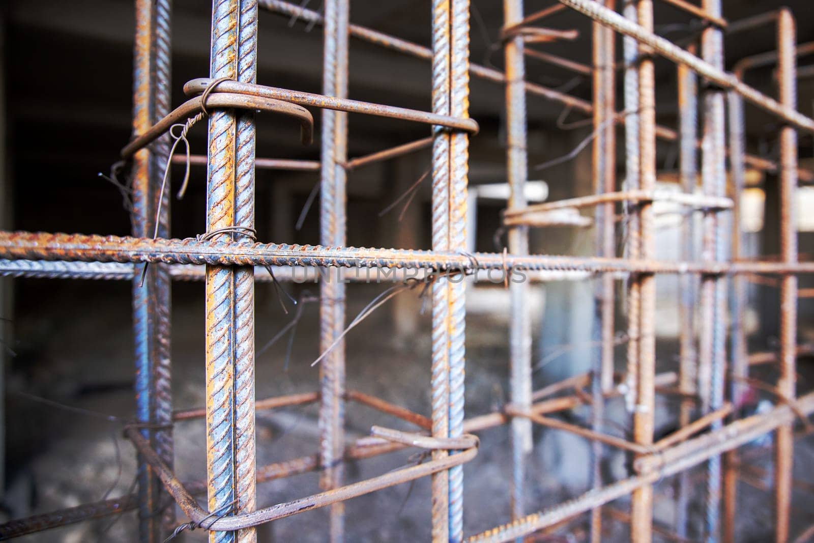 Frame structure for the basement made of reinforcement is ready for placing formwork to be poured with concrete.