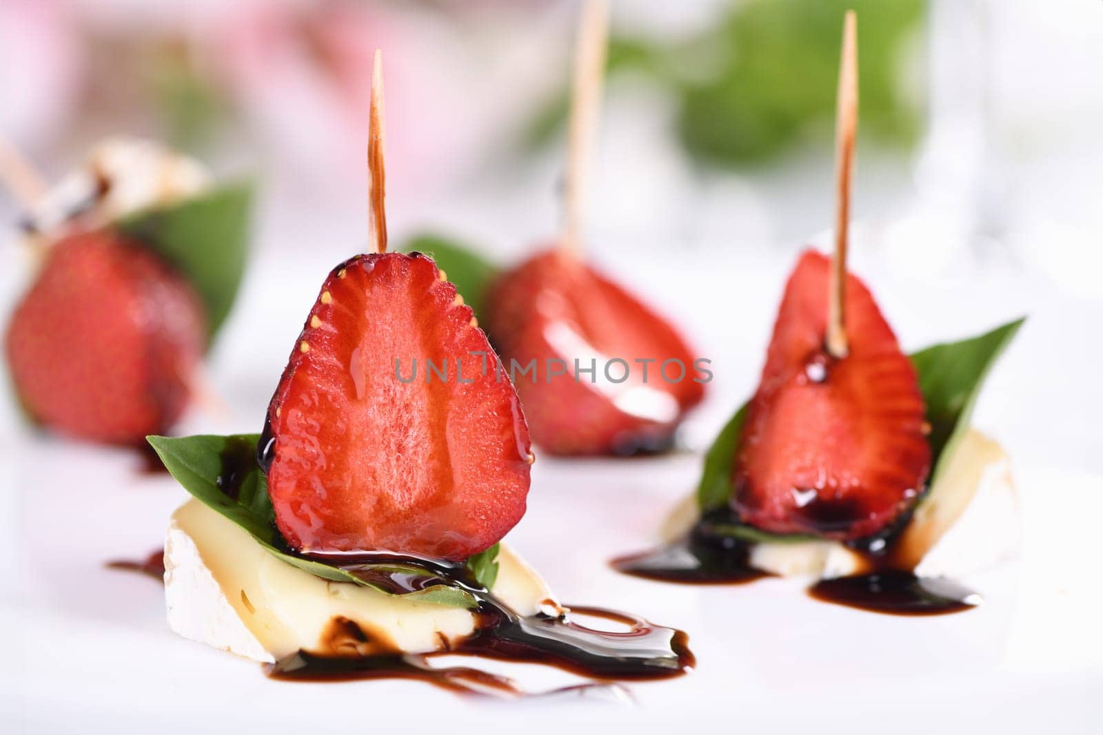 Strawberries, cheese, fresh basil and balsamic come together for a bite-sized appetizer