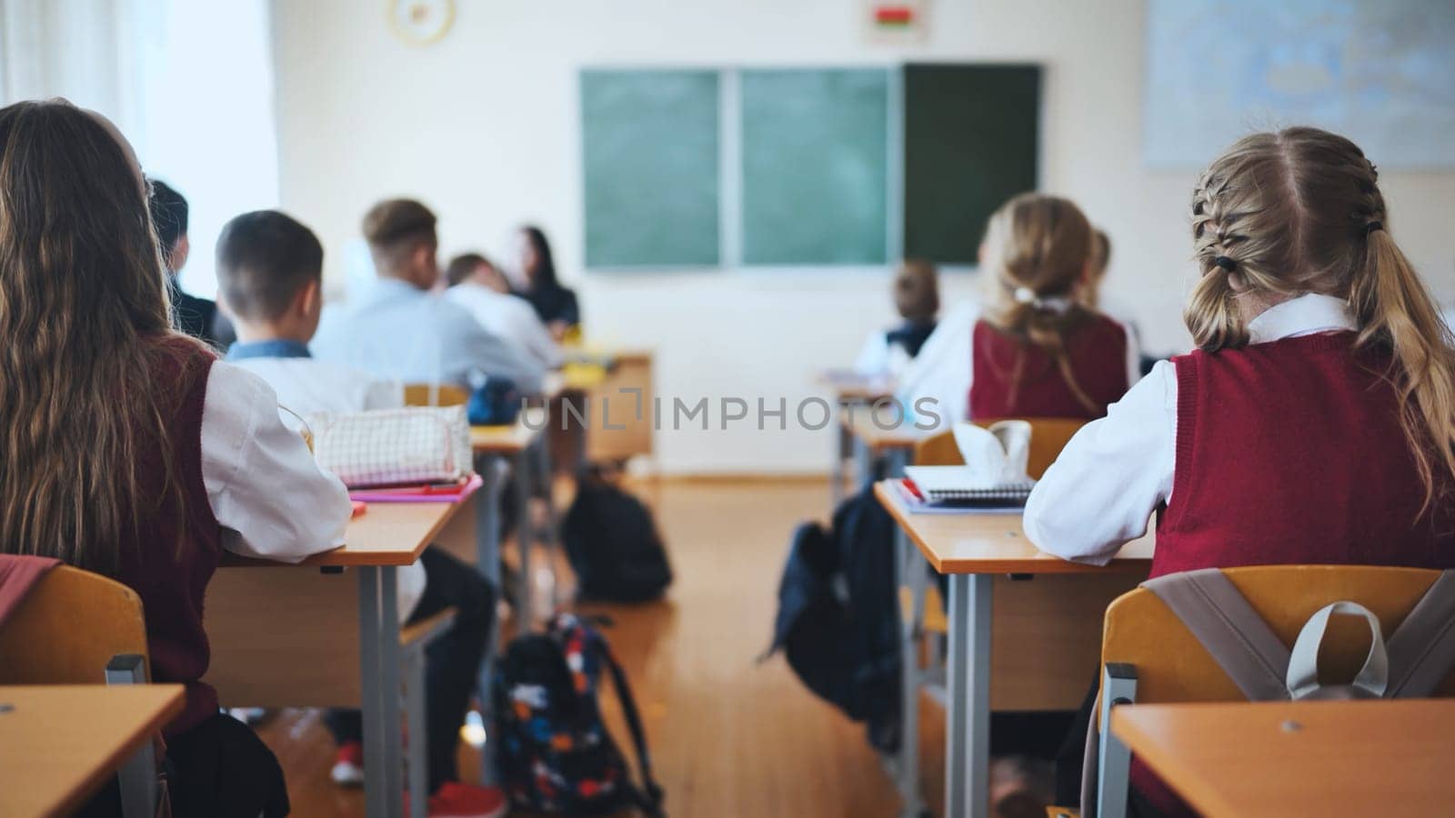 A junior high school class in a middle school. Back view