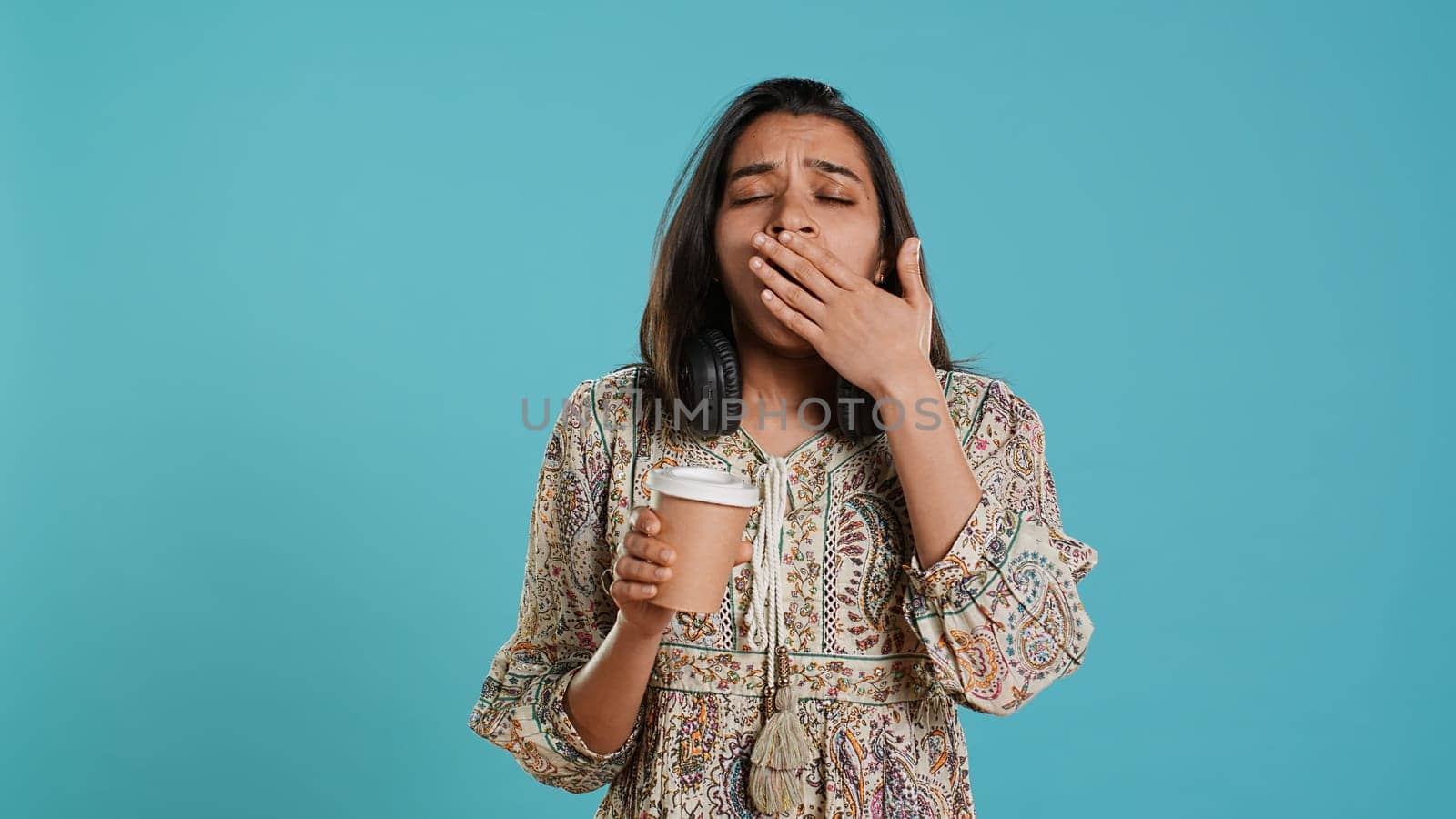 Tired person feeling drowsy after sleepless night, drinking coffee by DCStudio