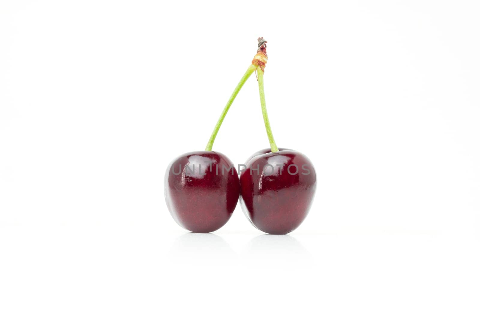 pair of Sweet cherries isolated on white background