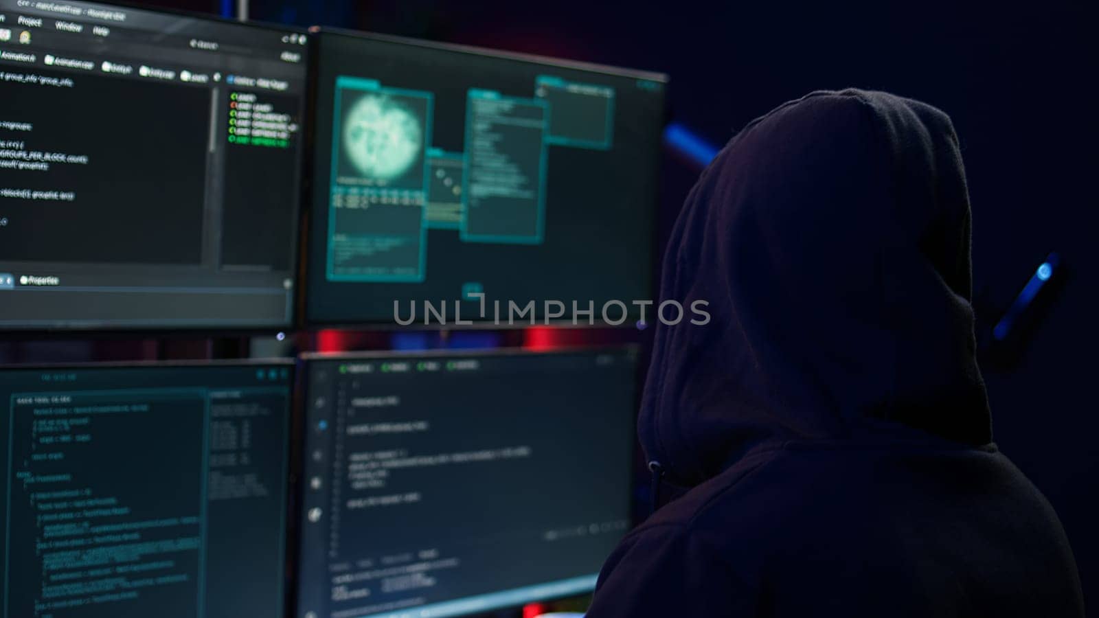 Close up of hacker running code in apartment on PC monitors by DCStudio