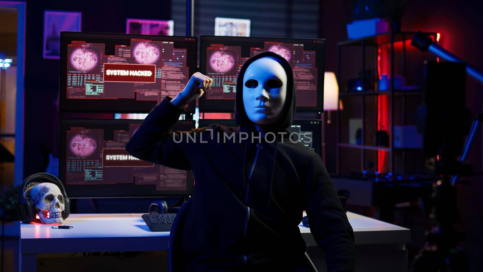 Hacker doing online activism, wearing anonymous masks and filming video by DCStudio