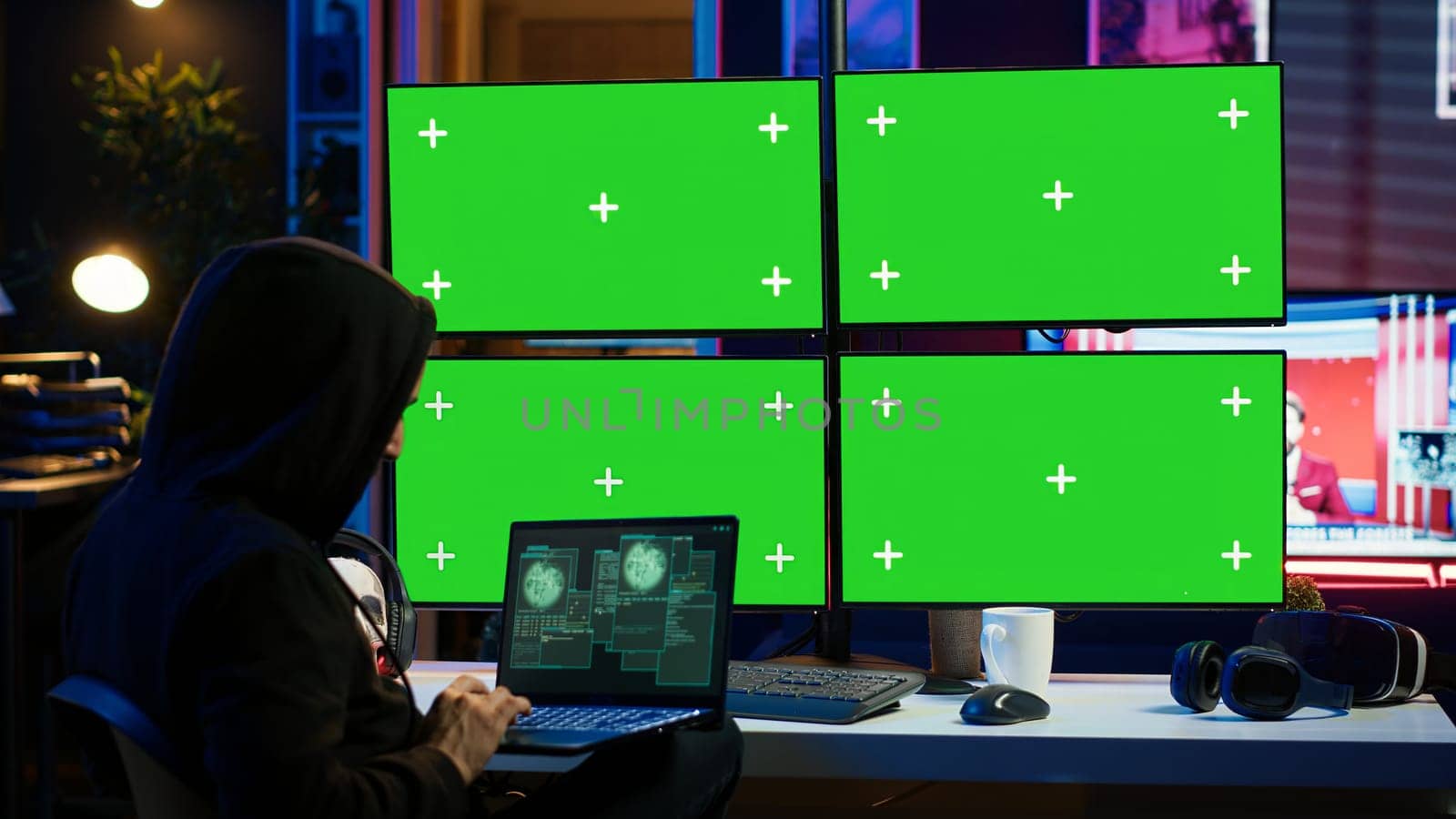 Man writing code on laptop in front of isolated screen PC monitors, trying to get past security systems. Hacker using chroma key computer and notebook to make scripts that can hack devices, camera A