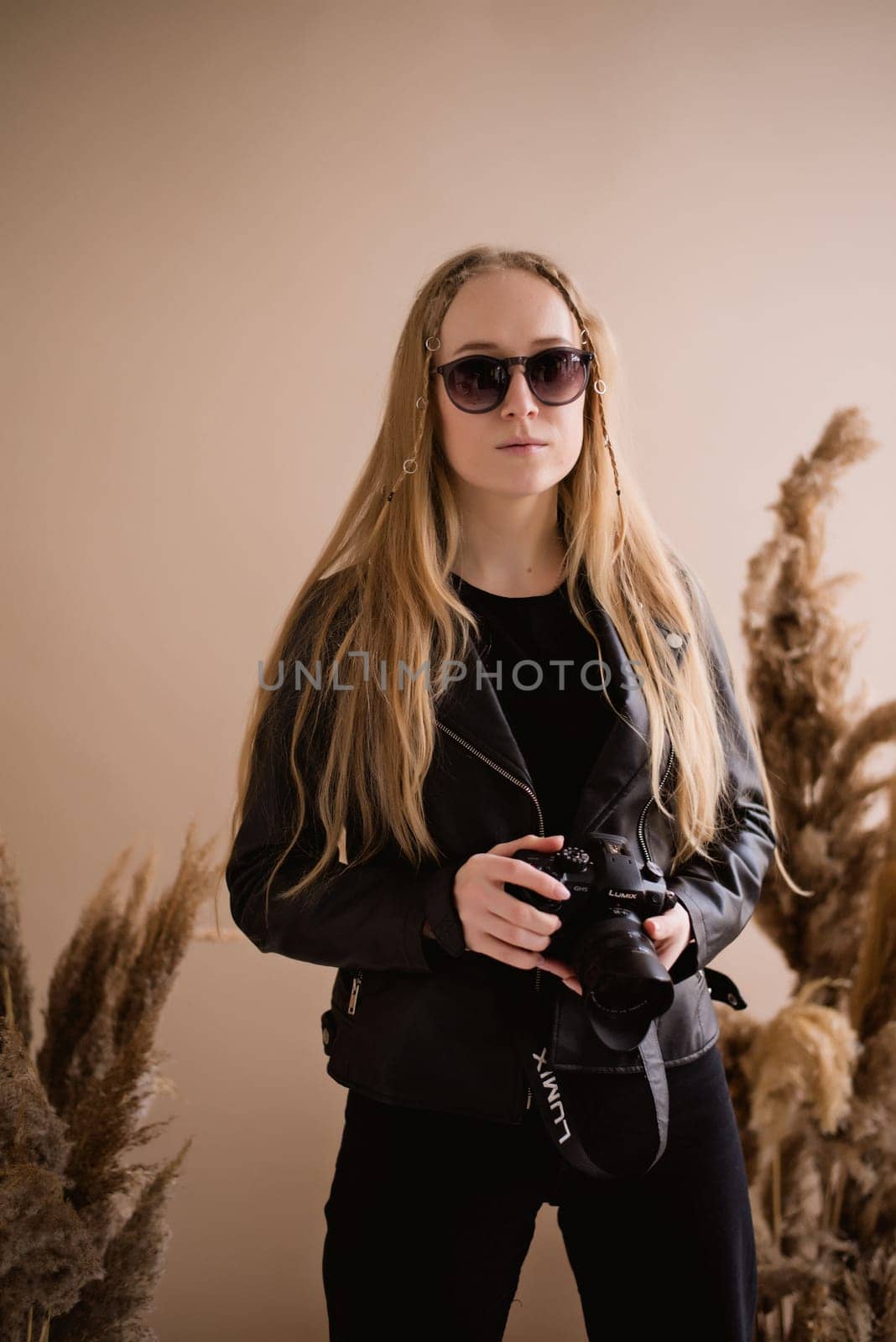 A woman photographer at production photo studio by OksanaFedorchuk