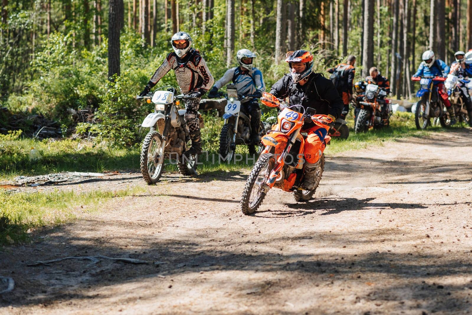 REPUBLIC OF KARELIA, RUSSIA - CIRCA JUNE, 2022: Off-road tournament Ladoga Trophy 2022 in Karelia. Motorcycle racers on sport off-road motorcycles before the start of the race