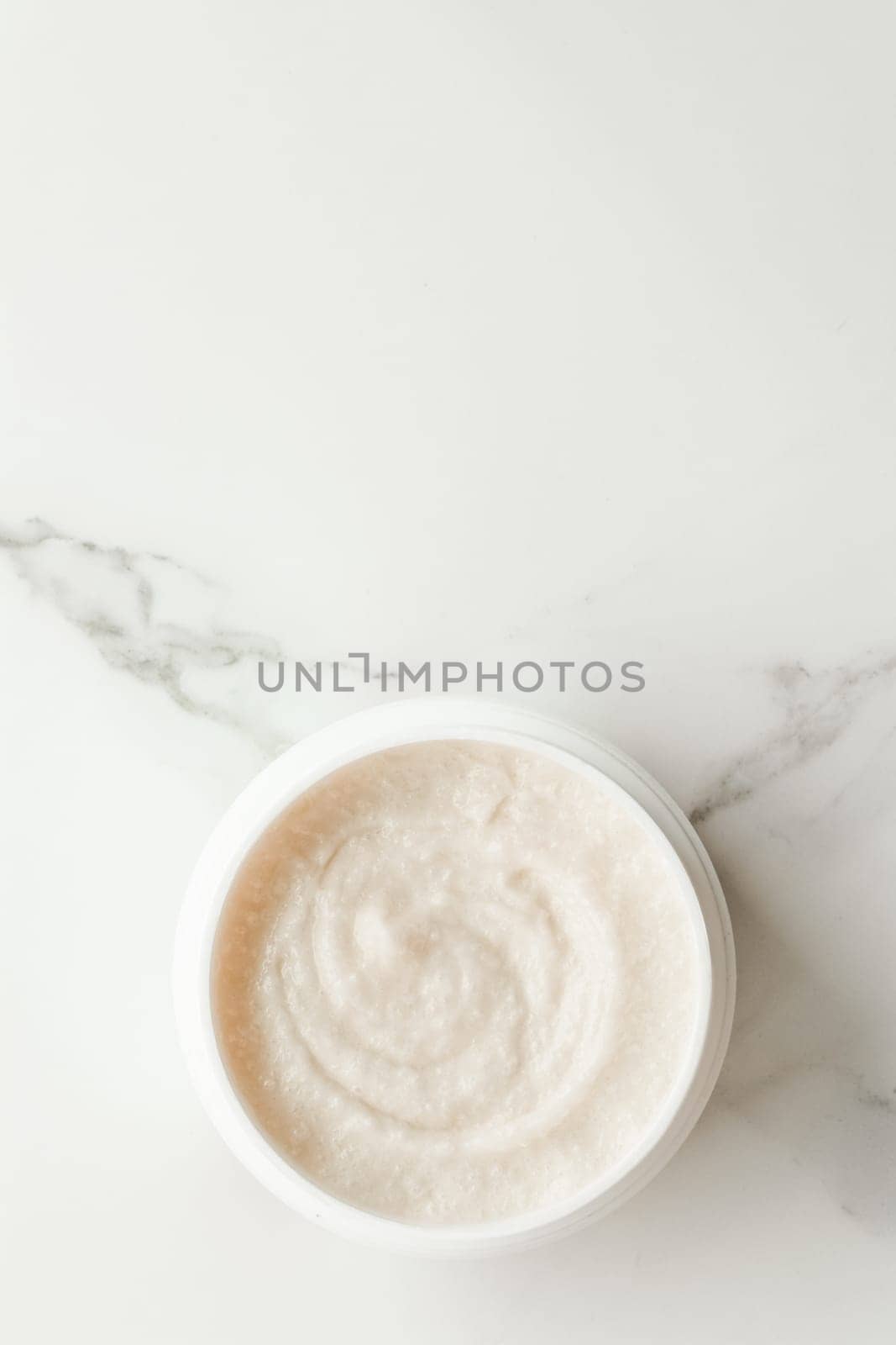 Scrub and exfoliating cream products on a marble, flatlay - skincare and body care, luxury spa and clean cosmetic concept. Health and beauty of your skin