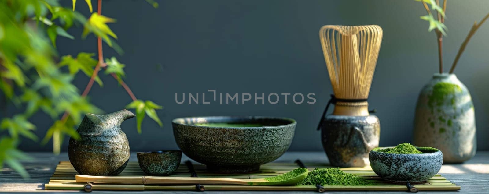 Traditional Japanese tea ceremony setup with matcha utensils and greenery, zen concept.