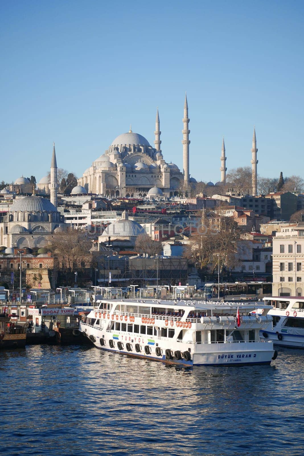 turkey istanbul 19 june 2023. ferryboats parked in the terminal in the Bosphorus river nearby the Eminonu Mosque.