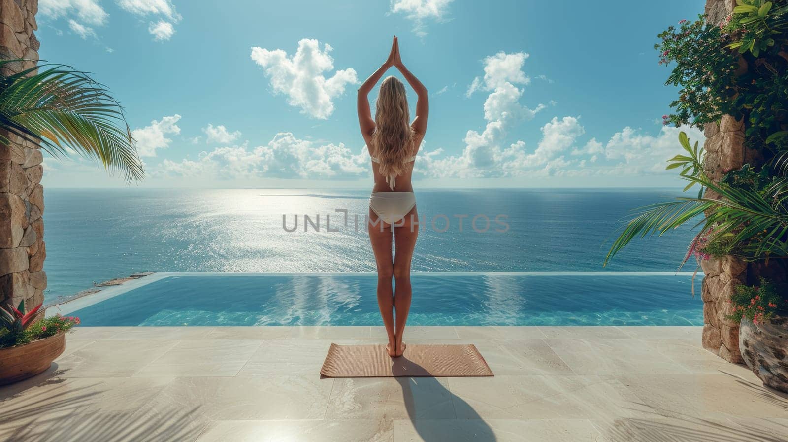 Woman practicing yoga at seaside infinity pool, morning meditation. Wellness and relaxation concept by Anastasiia