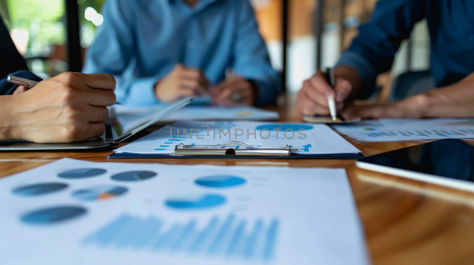 couple engaged in a discussion with a financial advisor about their retirement plans