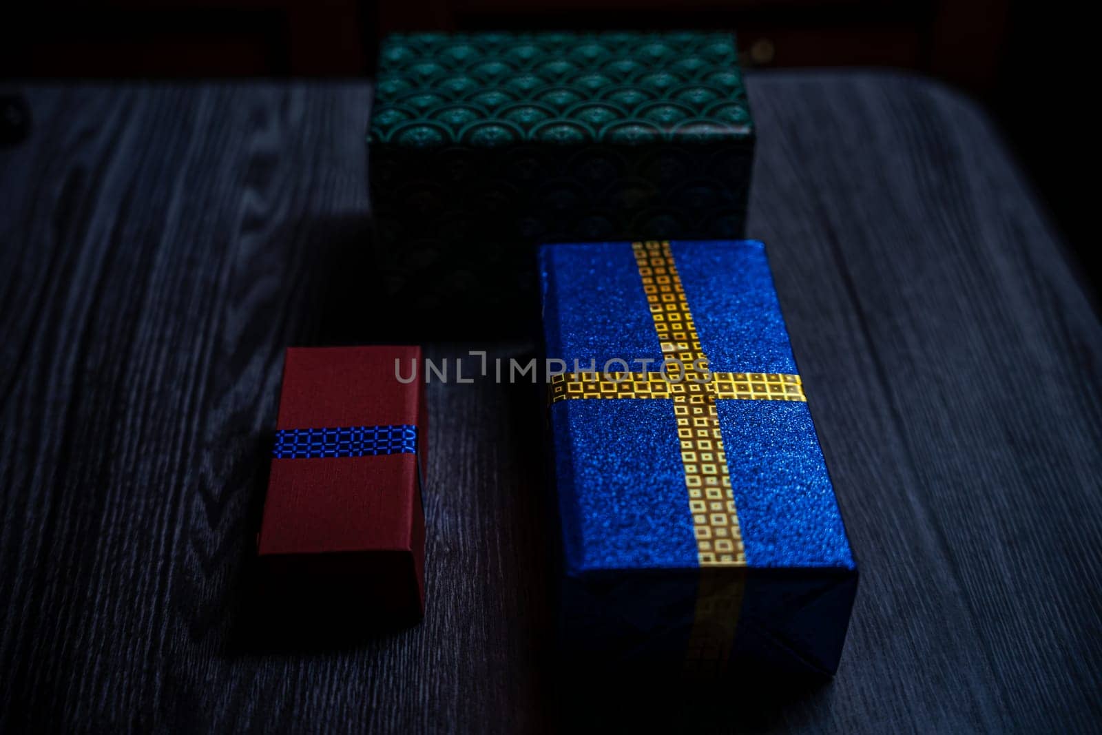 Boxes with gifts on a wooden table. High quality photo