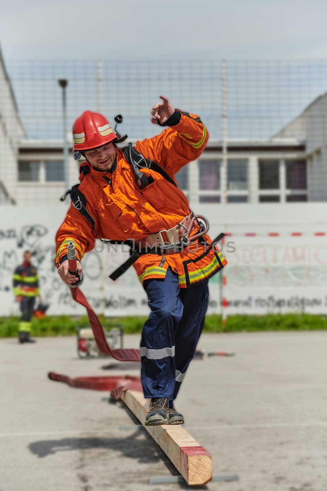 Firefighter Training and Preparing in Professional Gear for Job Hazards by dotshock