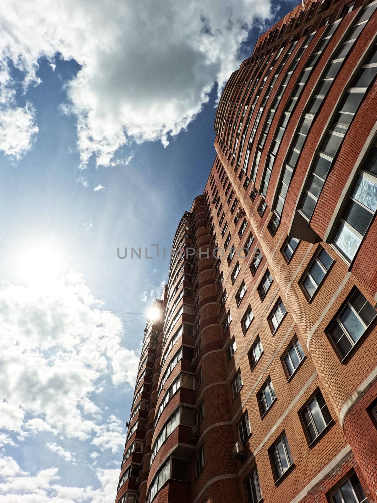 The corner of the infrastructure building in a residential area. Against the sky , under the sun. High quality photo