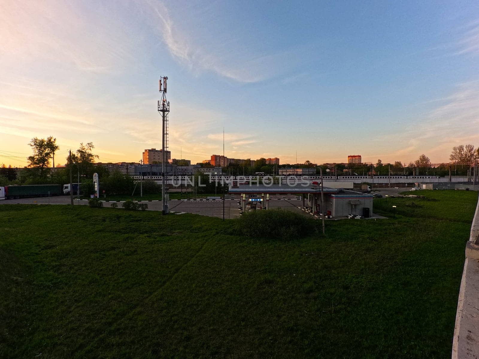 Sunset against the background of railway infrastructure solutions. sunset over the depot. High quality photo