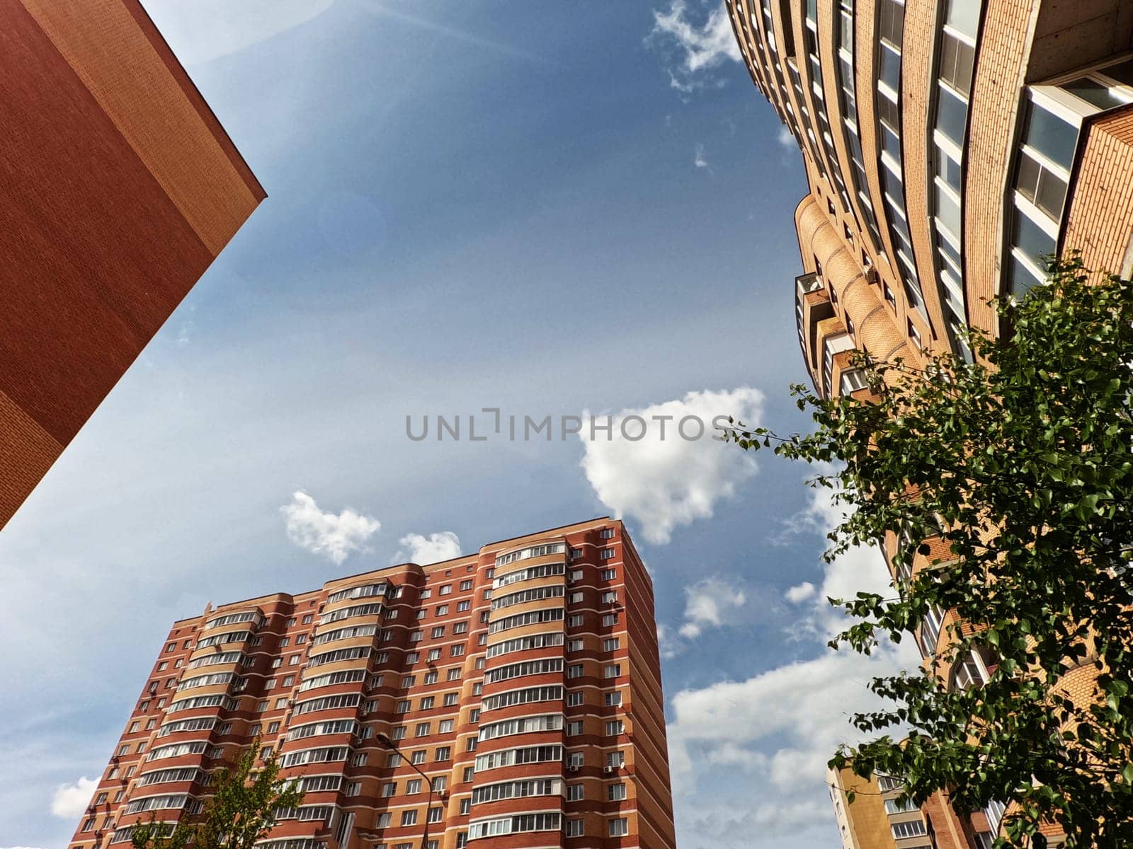 Three corners of the infrastructure buildings in a residential area. Against the sky , under the sun. High quality photo