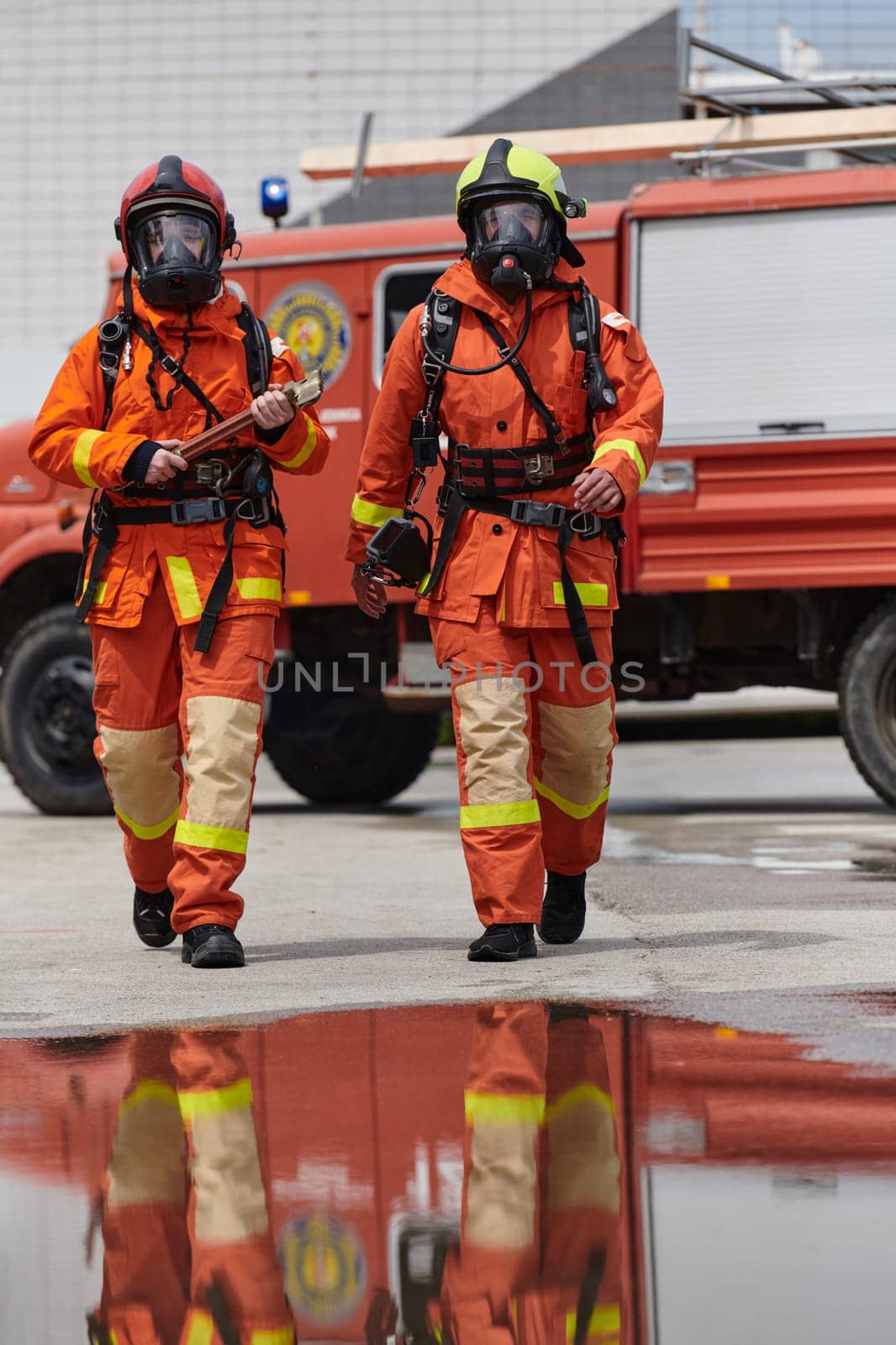 A team of confident and accomplished firefighters strides purposefully in their uniforms, exuding pride and satisfaction after successfully completing a challenging firefighting mission by dotshock