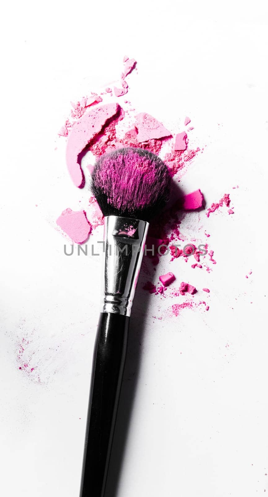 Beauty texture, cosmetic product and art of make-up concept - Brush with crushed eyeshadow and powder close-up isolated on white background