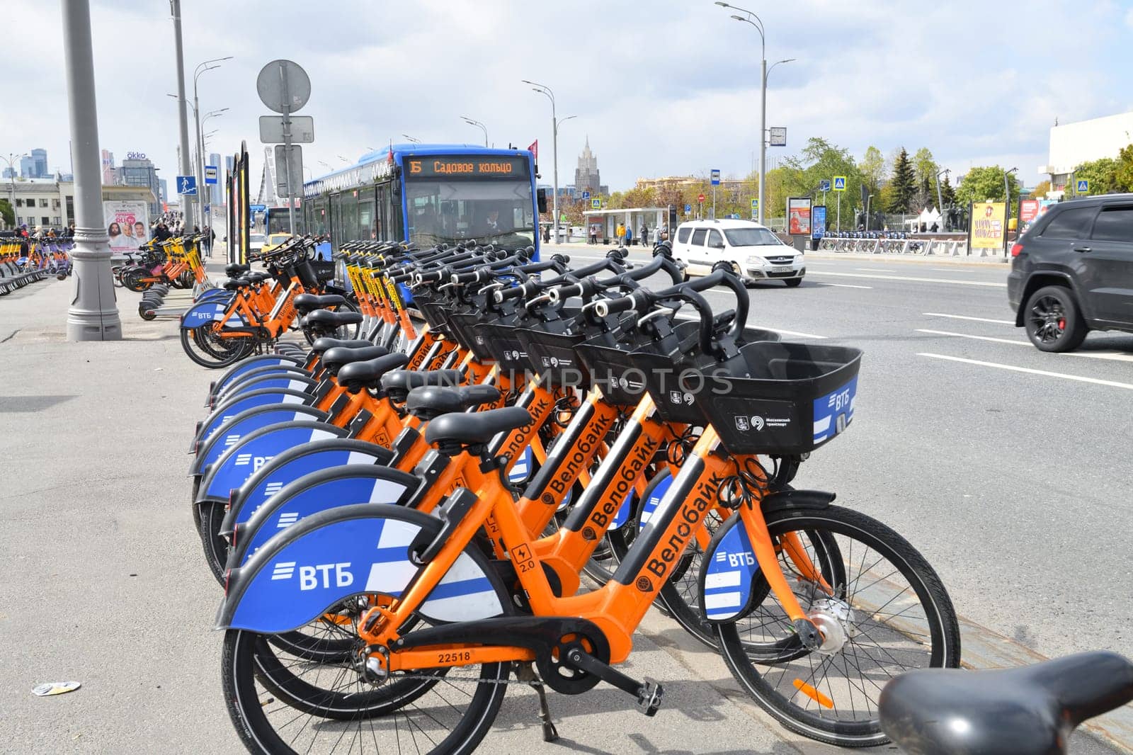 Moscow, Russia - May 9. 2024. Velobike - city bike rental with VTB Bank logo on the Garden Ring street by olgavolodina