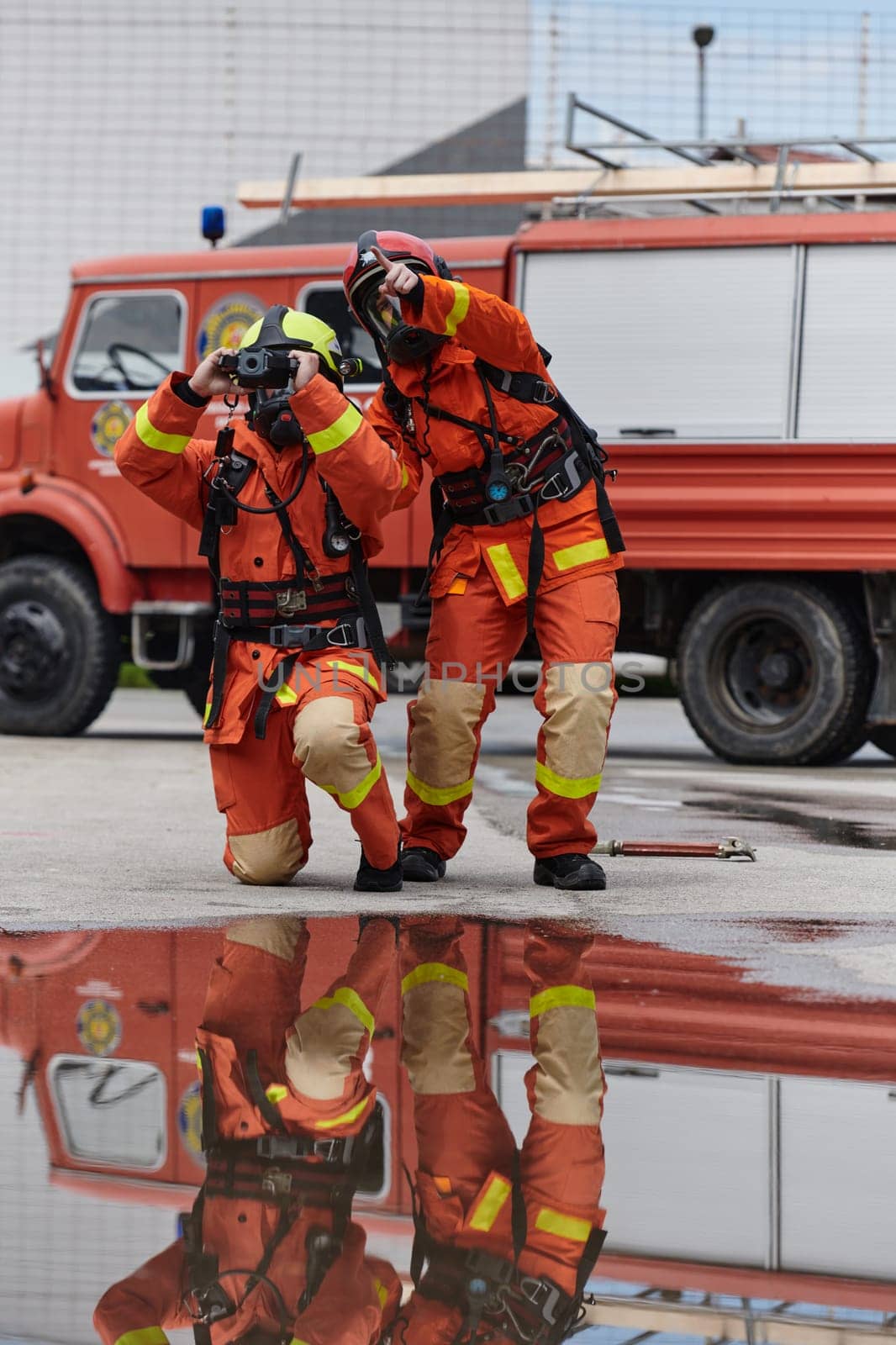 Firefighter Team Learning Thermal Camera Usage During Training Session by dotshock