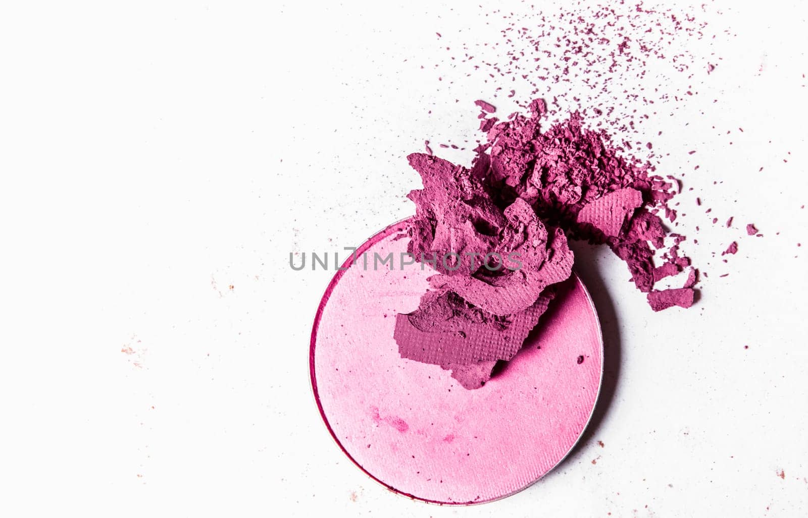 Crushed eyeshadow palette close-up isolated on white background by Anneleven