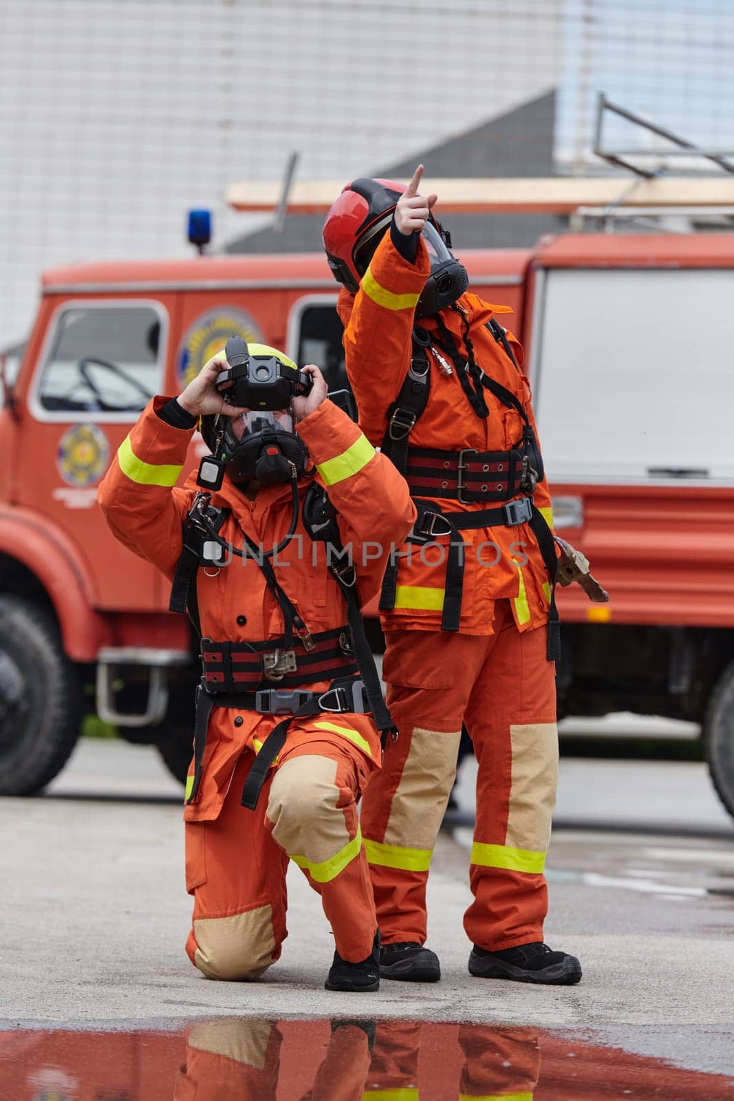 Firefighter Team Learning Thermal Camera Usage During Training Session by dotshock