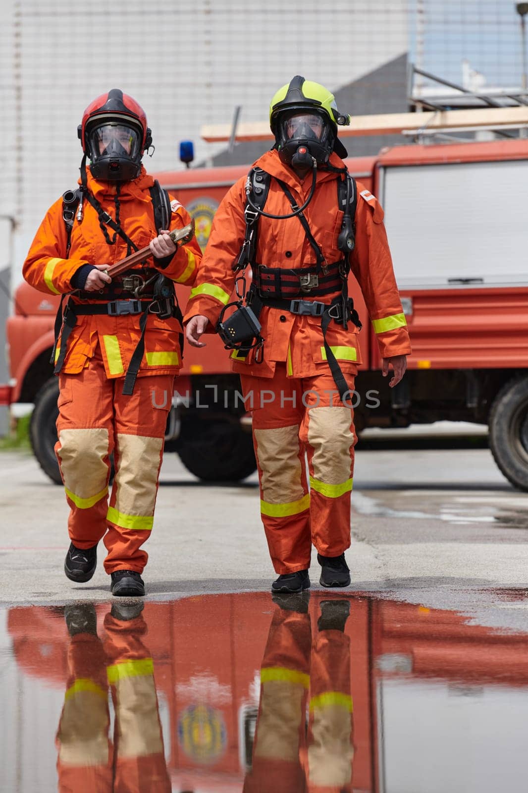 A team of confident and accomplished firefighters strides purposefully in their uniforms, exuding pride and satisfaction after successfully completing a challenging firefighting mission by dotshock