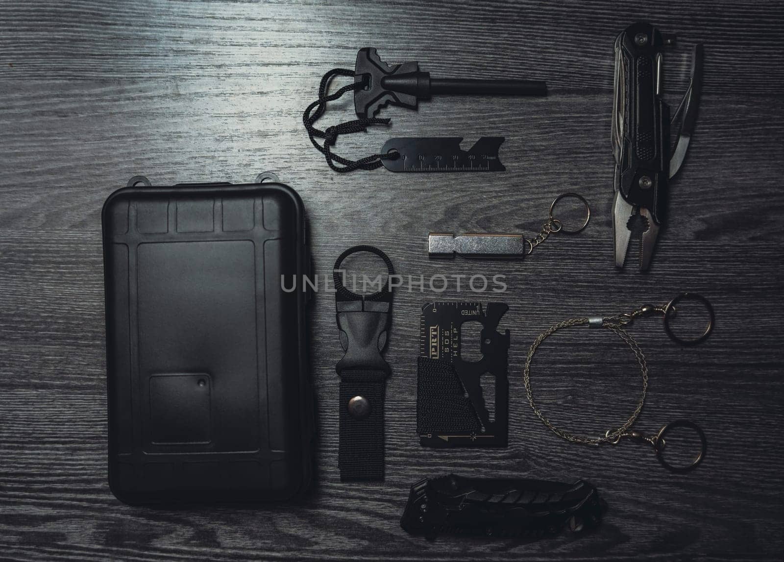 Wild Survival Kit. Items on a wooden table. Gloomy photo. High quality photo