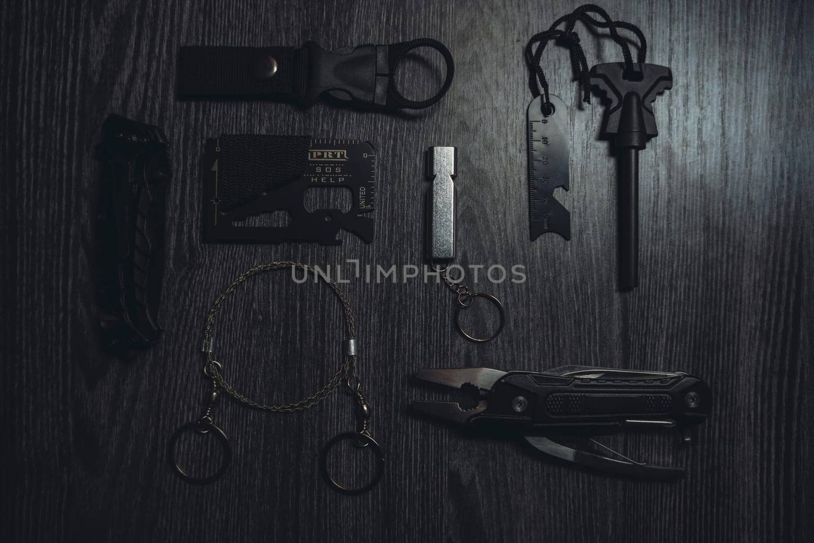 Wild Survival Kit. Items on a wooden table. Gloomy photo. High quality photo