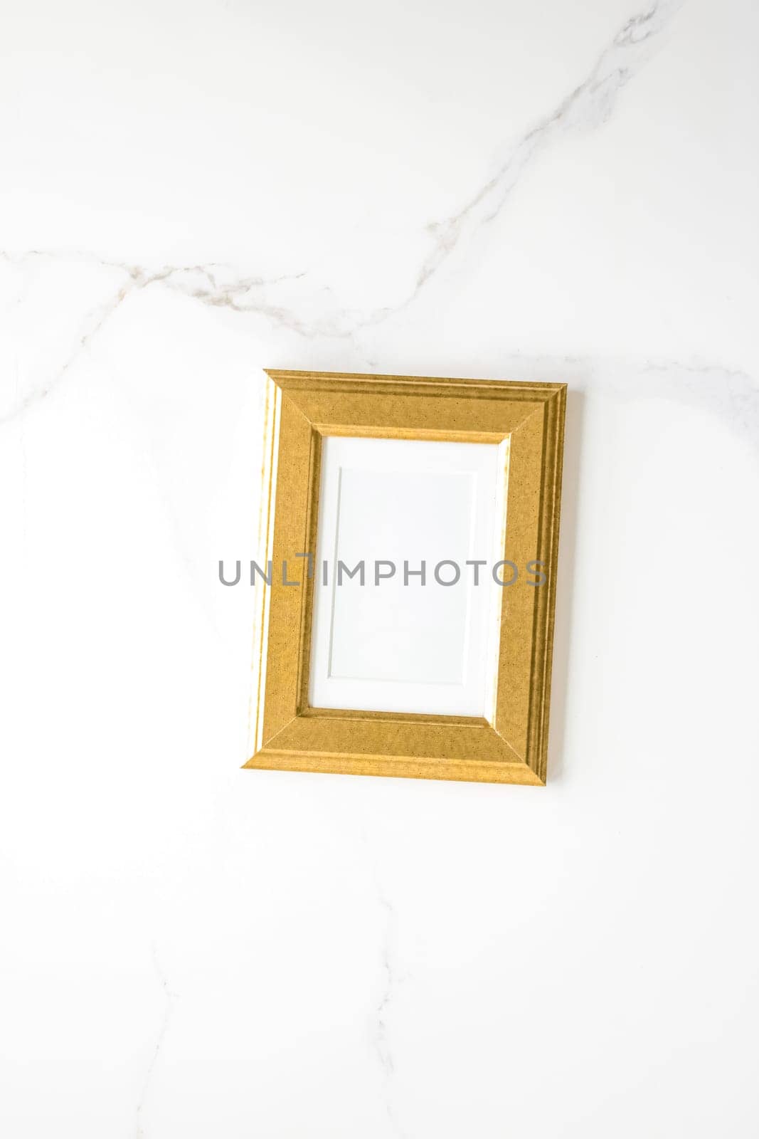 golden photo frame on marble, flatlay mockup - decor and mockup flatlay styled concept