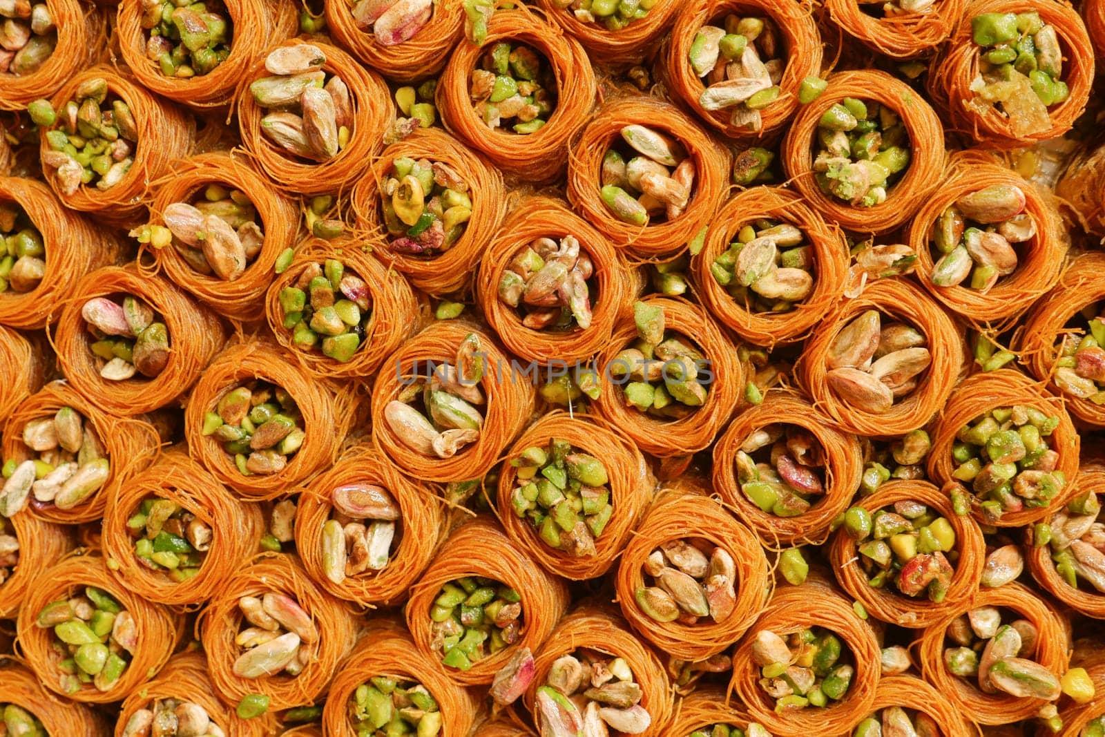 Traditional Turkish delight. Baklava with nuts and pistachios.
