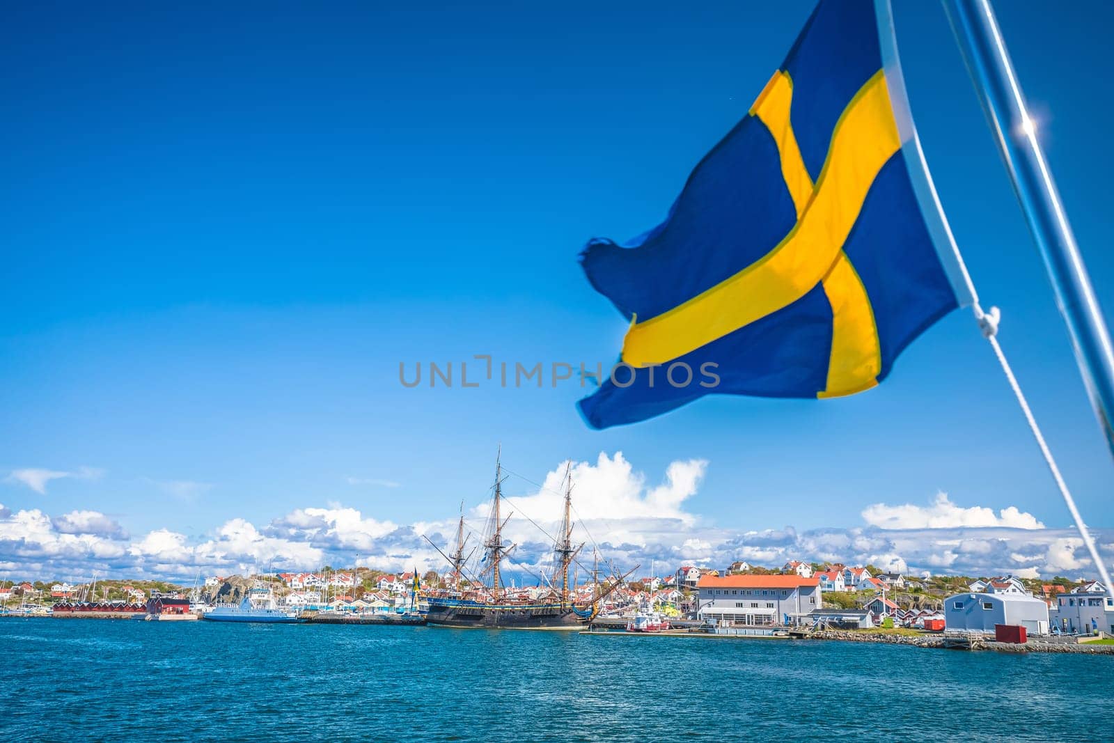 Swedish flag on the boat in Gothenburg islands archipelago near Donso island, Vastra Gotaland County, Sweden